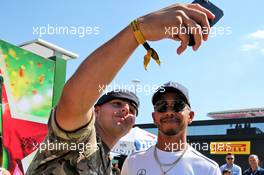 Lewis Hamilton (GBR) Mercedes AMG F1 with a fan. 05.07.2018. Formula 1 World Championship, Rd 10, British Grand Prix, Silverstone, England, Preparation Day.