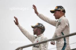(L to R): Valtteri Bottas (FIN) Mercedes AMG F1 celebrates on the podium with race winner Lewis Hamilton (GBR) Mercedes AMG F1. 22.07.2018. Formula 1 World Championship, Rd 11, German Grand Prix, Hockenheim, Germany, Race Day.