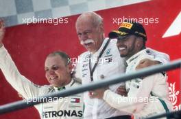 (L to R): Valtteri Bottas (FIN) Mercedes AMG F1 celebrates on the podium with Dr. Dieter Zetsche (GER) Daimler AG CEO and race winner Lewis Hamilton (GBR) Mercedes AMG F1. 22.07.2018. Formula 1 World Championship, Rd 11, German Grand Prix, Hockenheim, Germany, Race Day.