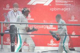 (L to R): Dr. Dieter Zetsche (GER) Daimler AG CEO celebrates on the podium with race winner Lewis Hamilton (GBR) Mercedes AMG F1 and second placed team mate Valtteri Bottas (FIN) Mercedes AMG F1. 22.07.2018. Formula 1 World Championship, Rd 11, German Grand Prix, Hockenheim, Germany, Race Day.
