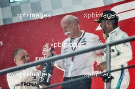 (L to R): Valtteri Bottas (FIN) Mercedes AMG F1 celebrates on the podium with Dr. Dieter Zetsche (GER) Daimler AG CEO and race winner Lewis Hamilton (GBR) Mercedes AMG F1. 22.07.2018. Formula 1 World Championship, Rd 11, German Grand Prix, Hockenheim, Germany, Race Day.