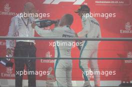 Valtteri Bottas (FIN) Mercedes AMG F1 celebrates his second position on the podium with Dr. Dieter Zetsche (GER) Daimler AG CEO and race winner Lewis Hamilton (GBR) Mercedes AMG F1. 22.07.2018. Formula 1 World Championship, Rd 11, German Grand Prix, Hockenheim, Germany, Race Day.