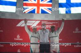 (L to R): Valtteri Bottas (FIN) Mercedes AMG F1 celebrates his second position on the podium with Dr. Dieter Zetsche (GER) Daimler AG CEO and race winner Lewis Hamilton (GBR) Mercedes AMG F1. 22.07.2018. Formula 1 World Championship, Rd 11, German Grand Prix, Hockenheim, Germany, Race Day.