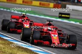 Sebastian Vettel (GER) Ferrari SF71H leads team mate Kimi Raikkonen (FIN) Ferrari SF71H. 22.07.2018. Formula 1 World Championship, Rd 11, German Grand Prix, Hockenheim, Germany, Race Day.