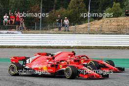 Sebastian Vettel (GER) Ferrari SF71H is allowed through into the lead of the race by team mate Kimi Raikkonen (FIN) Ferrari SF71H. 22.07.2018. Formula 1 World Championship, Rd 11, German Grand Prix, Hockenheim, Germany, Race Day.