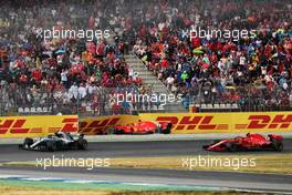 Sebastian Vettel (GER) Ferrari SF71H crashed out of the race and is passed by Valtteri Bottas (FIN) Mercedes AMG F1 W09 and Kimi Raikkonen (FIN) Ferrari SF71H. 22.07.2018. Formula 1 World Championship, Rd 11, German Grand Prix, Hockenheim, Germany, Race Day.