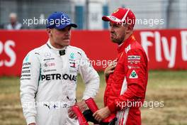 (L to R): Valtteri Bottas (FIN) Mercedes AMG F1 with pole sitter Sebastian Vettel (GER) Ferrari in qualifying parc ferme. 21.07.2018. Formula 1 World Championship, Rd 11, German Grand Prix, Hockenheim, Germany, Qualifying Day.