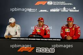 The post qualifying FIA Press Conference (L to R): Valtteri Bottas (FIN) Mercedes AMG F1, second; Sebastian Vettel (GER) Ferrari, pole position; Kimi Raikkonen (FIN) Ferrari, third. 21.07.2018. Formula 1 World Championship, Rd 11, German Grand Prix, Hockenheim, Germany, Qualifying Day.