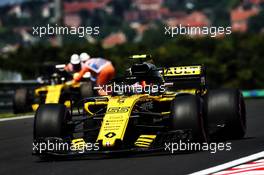 Carlos Sainz Jr (ESP) Renault Sport F1 Team RS18 passes the Renault Sport F1 Team RS18 of team mate Nico Hulkenberg (GER) who stopped in the first practice session. 20.07.2018. Formula 1 World Championship, Rd 11, German Grand Prix, Hockenheim, Germany, Practice Day.