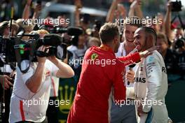 Lewis Hamilton (GBR) Mercedes AMG F1  and Sebastian Vettel (GER) Scuderia Ferrari with Paul Di Resta 29.07.2018. Formula 1 World Championship, Rd 12, Hungarian Grand Prix, Budapest, Hungary, Race Day.