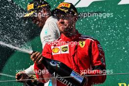 Sebastian Vettel (GER) Ferrari celebrates his second position on the podium with race winner Lewis Hamilton (GBR) Mercedes AMG F1. 29.07.2018. Formula 1 World Championship, Rd 12, Hungarian Grand Prix, Budapest, Hungary, Race Day.