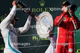 Race winner Lewis Hamilton (GBR) Mercedes AMG F1 celebrates with Sebastian Vettel (GER) Ferrari on the podium. 29.07.2018. Formula 1 World Championship, Rd 12, Hungarian Grand Prix, Budapest, Hungary, Race Day.