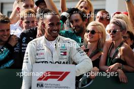 Race winner Lewis Hamilton (GBR) Mercedes AMG F1 with the team and Barbara Palvin (HUN) Model (Right) in parc ferme. 29.07.2018. Formula 1 World Championship, Rd 12, Hungarian Grand Prix, Budapest, Hungary, Race Day.