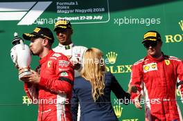 Sebastian Vettel (GER) Ferrari celebrates his second position on the podium. 29.07.2018. Formula 1 World Championship, Rd 12, Hungarian Grand Prix, Budapest, Hungary, Race Day.