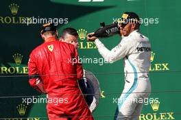 (L to R): Sebastian Vettel (GER) Ferrari celebrates with the champagne his second position on the podium with race winner Lewis Hamilton (GBR) Mercedes AMG F1. 29.07.2018. Formula 1 World Championship, Rd 12, Hungarian Grand Prix, Budapest, Hungary, Race Day.