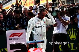 Race winner Lewis Hamilton (GBR) Mercedes AMG F1 celebrates with the team in parc ferme. 29.07.2018. Formula 1 World Championship, Rd 12, Hungarian Grand Prix, Budapest, Hungary, Race Day.