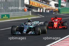 Valtteri Bottas (FIN) Mercedes AMG F1 and Sebastian Vettel (GER) Scuderia Ferrari  29.07.2018. Formula 1 World Championship, Rd 12, Hungarian Grand Prix, Budapest, Hungary, Race Day.