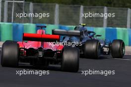 Sebastian Vettel (GER) Scuderia Ferrari and Valtteri Bottas (FIN) Mercedes AMG F1  29.07.2018. Formula 1 World Championship, Rd 12, Hungarian Grand Prix, Budapest, Hungary, Race Day.