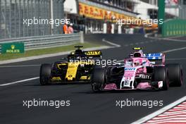 Carlos Sainz Jr (ESP) Renault F1 Team and Esteban Ocon (FRA) Force India F1  29.07.2018. Formula 1 World Championship, Rd 12, Hungarian Grand Prix, Budapest, Hungary, Race Day.