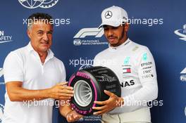 Lewis Hamilton (GBR) Mercedes AMG F1 receives the Pirelli Pole Position award from Jean Alesi (FRA). 28.07.2018. Formula 1 World Championship, Rd 12, Hungarian Grand Prix, Budapest, Hungary, Qualifying Day.