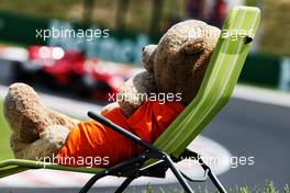 Sebastian Vettel (GER) Ferrari SF71H watched by a teddy bear on a deck chair. 28.07.2018. Formula 1 World Championship, Rd 12, Hungarian Grand Prix, Budapest, Hungary, Qualifying Day.