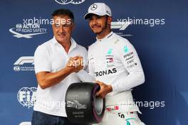 Lewis Hamilton (GBR) Mercedes AMG F1 receives the Pirelli Pole Position award from Jean Alesi (FRA). 28.07.2018. Formula 1 World Championship, Rd 12, Hungarian Grand Prix, Budapest, Hungary, Qualifying Day.