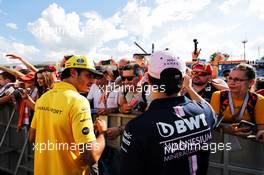 (L to R): Carlos Sainz Jr (ESP) Renault Sport F1 Team and Sergio Perez (MEX) Sahara Force India F1 sign autographs for the fans. 26.07.2018. Formula 1 World Championship, Rd 12, Hungarian Grand Prix, Budapest, Hungary, Preparation Day.