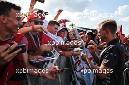 Kevin Magnussen (DEN) Haas F1 Team signs autographs for the fans. 26.07.2018. Formula 1 World Championship, Rd 12, Hungarian Grand Prix, Budapest, Hungary, Preparation Day.