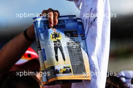 Carlos Sainz Jr (ESP) Renault Sport F1 Team in a fan's magazine. 26.07.2018. Formula 1 World Championship, Rd 12, Hungarian Grand Prix, Budapest, Hungary, Preparation Day.