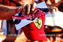 Ferrari cap and a picture of Kimi Raikkonen (FIN) Ferrari. 26.07.2018. Formula 1 World Championship, Rd 12, Hungarian Grand Prix, Budapest, Hungary, Preparation Day.