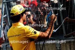 Carlos Sainz Jr (ESP) Renault Sport F1 Team signs autographs for the fans. 26.07.2018. Formula 1 World Championship, Rd 12, Hungarian Grand Prix, Budapest, Hungary, Preparation Day.