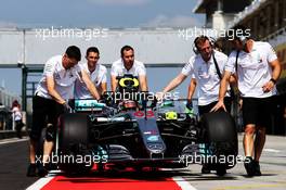 George Russell (GBR) Mercedes AMG F1 W09 Reserve Driver is pushed down the pit lane by a mechanic. 01.08.2018. Formula 1 Testing, Budapest, Hungary.