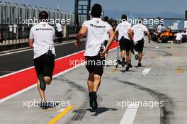 Mercedes AMG F1 mechanics run down the pit lane. 01.08.2018. Formula 1 Testing, Budapest, Hungary.
