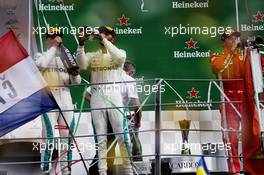 Race winner Lewis Hamilton (GBR) Mercedes AMG F1 (Centre) celebrates with third placed team mate Valtteri Bottas (FIN) Mercedes AMG F1 (Left) and second placed Kimi Raikkonen (FIN) Ferrari (Right) on the podium. 02.09.2018. Formula 1 World Championship, Rd 14, Italian Grand Prix, Monza, Italy, Race Day.