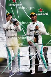 Race winner Lewis Hamilton (GBR) Mercedes AMG F1 (Right) celebrates with third placed team mate Valtteri Bottas (FIN) Mercedes AMG F1 on the podium. 02.09.2018. Formula 1 World Championship, Rd 14, Italian Grand Prix, Monza, Italy, Race Day.