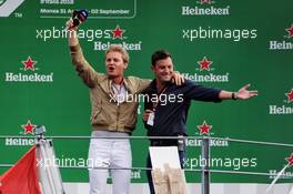 (L to R): Nico Rosberg (GER) with Will Buxton (GBR) F1 Digital Presenter on the podium. 02.09.2018. Formula 1 World Championship, Rd 14, Italian Grand Prix, Monza, Italy, Race Day.