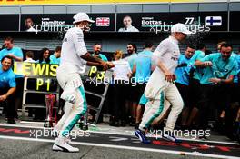 Race winner Lewis Hamilton (GBR) Mercedes AMG F1 celebrates with third placed Valtteri Bottas (FIN) Mercedes AMG F1 and the team. 02.09.2018. Formula 1 World Championship, Rd 14, Italian Grand Prix, Monza, Italy, Race Day.