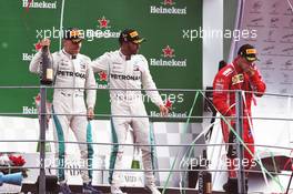 The podium (L to R): third placed Valtteri Bottas (FIN) Mercedes AMG F1 with race winner and team mate Lewis Hamilton (GBR) Mercedes AMG F1, and second placed Kimi Raikkonen (FIN) Ferrari. 02.09.2018. Formula 1 World Championship, Rd 14, Italian Grand Prix, Monza, Italy, Race Day.