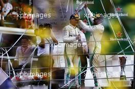 Race winner Lewis Hamilton (GBR) Mercedes AMG F1 (Right) celebrates with third placed team mate Valtteri Bottas (FIN) Mercedes AMG F1 on the podium. 02.09.2018. Formula 1 World Championship, Rd 14, Italian Grand Prix, Monza, Italy, Race Day.