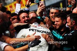 Race winner Lewis Hamilton (GBR) Mercedes AMG F1 W09 celebrates with the team in parc ferme. 02.09.2018. Formula 1 World Championship, Rd 14, Italian Grand Prix, Monza, Italy, Race Day.