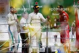 Race winner Lewis Hamilton (GBR) Mercedes AMG F1 (Centre) celebrates with third placed team mate Valtteri Bottas (FIN) Mercedes AMG F1 (Left) and second placed Kimi Raikkonen (FIN) Ferrari (Right) on the podium. 02.09.2018. Formula 1 World Championship, Rd 14, Italian Grand Prix, Monza, Italy, Race Day.