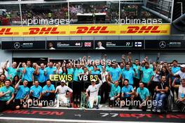 (L to R): Race winner Lewis Hamilton (GBR) Mercedes AMG F1 celebrates with third placed team mate Valtteri Bottas (FIN) Mercedes AMG F1 and the team. 02.09.2018. Formula 1 World Championship, Rd 14, Italian Grand Prix, Monza, Italy, Race Day.