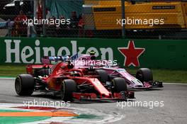 Sebastian Vettel (GER) Ferrari SF71H and Esteban Ocon (FRA) Racing Point Force India F1 VJM11 battle for position. 02.09.2018. Formula 1 World Championship, Rd 14, Italian Grand Prix, Monza, Italy, Race Day.