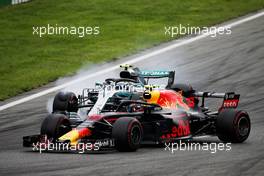 Max Verstappen (NLD) Red Bull Racing RB14 and Daniel Ricciardo (AUS) Red Bull Racing RB14 battle for position. 02.09.2018. Formula 1 World Championship, Rd 14, Italian Grand Prix, Monza, Italy, Race Day.