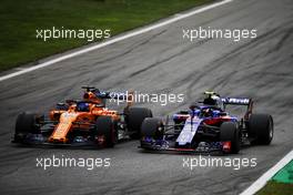 (L to R): Fernando Alonso (ESP) McLaren MCL33 and Pierre Gasly (FRA) Scuderia Toro Rosso STR13 battle for position. 02.09.2018. Formula 1 World Championship, Rd 14, Italian Grand Prix, Monza, Italy, Race Day.