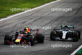 Max Verstappen (NLD) Red Bull Racing RB14 and Valtteri Bottas (FIN) Mercedes AMG F1 W09 battle for position. 02.09.2018. Formula 1 World Championship, Rd 14, Italian Grand Prix, Monza, Italy, Race Day.