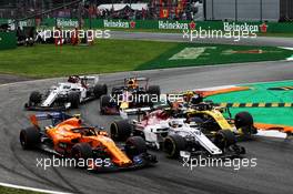 Stoffel Vandoorne (BEL) McLaren MCL33, Charles Leclerc (MON) Sauber F1 Team C37, and Nico Hulkenberg (GER) Renault Sport F1 Team RS18 at the start of the race. 02.09.2018. Formula 1 World Championship, Rd 14, Italian Grand Prix, Monza, Italy, Race Day.