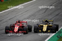 Sebastian Vettel (GER) Ferrari SF71H and Carlos Sainz Jr (ESP) Renault Sport F1 Team RS18 battle for position. 02.09.2018. Formula 1 World Championship, Rd 14, Italian Grand Prix, Monza, Italy, Race Day.