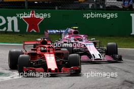 Sebastian Vettel (GER) Ferrari SF71H and Esteban Ocon (FRA) Racing Point Force India F1 VJM11 battle for position. 02.09.2018. Formula 1 World Championship, Rd 14, Italian Grand Prix, Monza, Italy, Race Day.