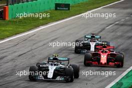 Valtteri Bottas (FIN) Mercedes AMG F1 W09 leads Kimi Raikkonen (FIN) Ferrari SF71H and Lewis Hamilton (GBR) Mercedes AMG F1 W09. 02.09.2018. Formula 1 World Championship, Rd 14, Italian Grand Prix, Monza, Italy, Race Day.